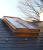 Copper frame, single slope style on slate roof