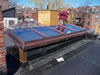 Copper clad motorized skylight access hatch for a Brownstone residence.